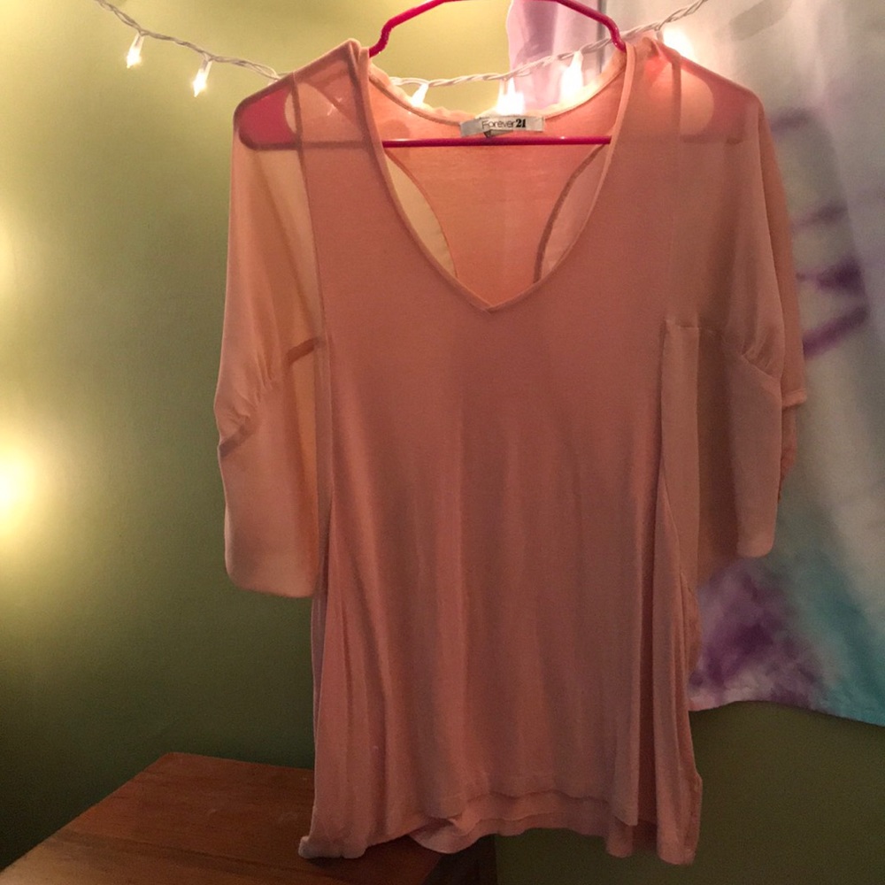 Loose light salmon colored blouse